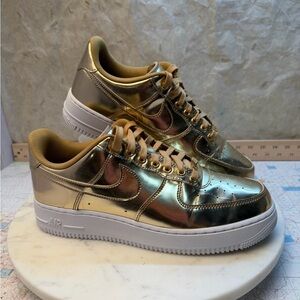 Nike woman’s Airforce 1s Gold metallic size 10.5